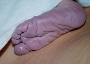 so fresh from his mother's womb his skin hasn't even gotten any color yet.